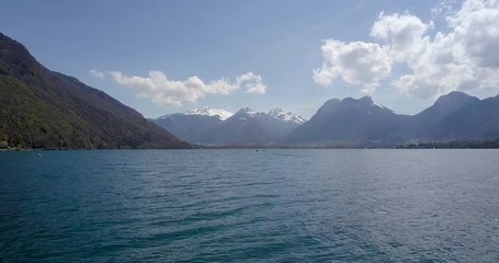 Canvas Print - Closeup fast forward moving drone video over the Lake Annecy France