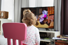 Todler Watching Cartoons. Problems Of Modern Parenthooding