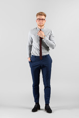 Canvas Print - Fashionable young man on grey background