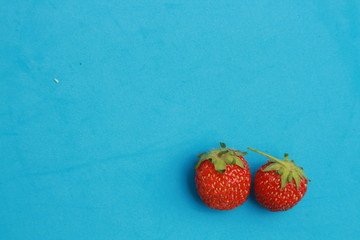 delicious wild fruits on white wooden background..