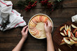 © Pablo Garcia/ADDICTIVE STOCK - unrecognizable woman making a apple pie on a wooden table
