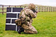 A Soldier From The British Army Trains On A Military Firing Range With An Assault Rifle