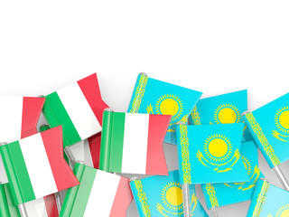 Pins with flags of Italy and kazakhstan isolated on white.