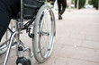 © JoseManuel - Wheelchair on the outside, in a park on a brick floor