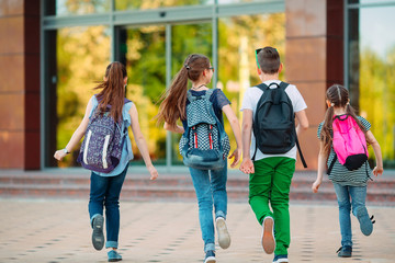 Wall Mural - Group of kids going to school together.