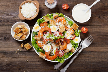 Wall Mural - Caesar Salad with Shrimp served with croutons,caesar sauce and parmesan.