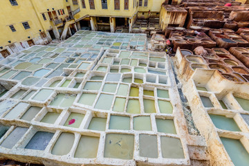 Wall Mural - Sightseeing of Morocco. Tanneries of Fez. Dye reservoirs and vats in traditional tannery of city of Fez, Morocco