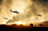 Military helicopters, forces and tanks in plane in war at sunset
