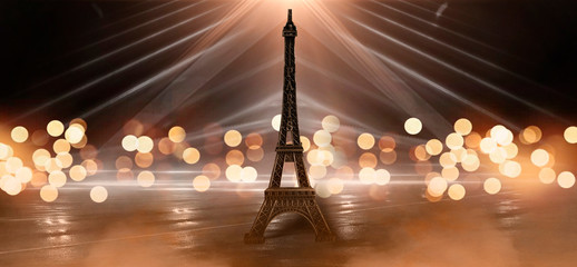 Night scene, wet asphalt and eiffel tower. Night view, neon lights, rays and light lines. Smoke, smog, dark street.