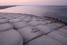 Concrete Steps Of An Sea Defence Barrier  On A Sunset Background.
