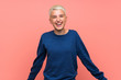 © luismolinero - Teenager girl with white short hair over pink wall smiling
