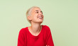 Teenager girl with white short hair over green wall happy and smiling
