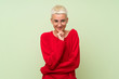 © luismolinero - Teenager girl with white short hair over green wall with glasses and smiling