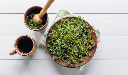 Preparation of herbs, fresh thyme on a wooden background, alternative medicine