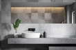 Close up of gray tile bathroom with sink