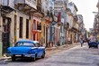 Rear view of the old blue car parked on the street in Havana Vieja, Cuba