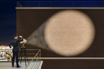 Aufkleber - Businessman looking at brick wall with spotlight