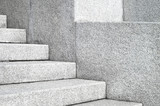 Fototapeta Na sufit - The edges and corners of the stone granite stairs. Concrete fragments of steps architecture close-up.