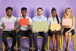 © alfa27 - group of young multiethnic people sitting on chairs with thought bubbles in hands looking in camera waiting for job interview