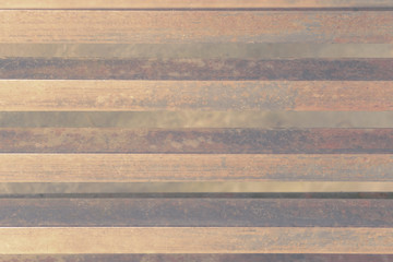 Rusty texture. Grunge background, stripes of steel, pastel pink tones.