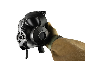 Wall Mural - Isolated first person view military hand holding gas mask.