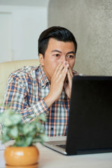 Businessman reading shocking news