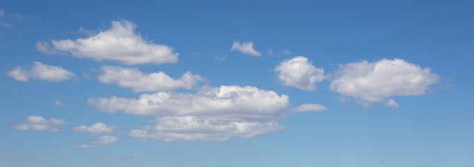 Wall Mural - White clouds in a blue sky