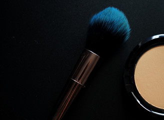 makeup brush and powder