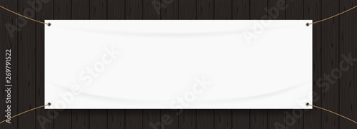 Fotomural vinyl banner blank white isolated on black wood frame, white mock up textile fab