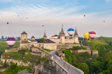 Beautiful ancient fortress in Kamyanets-Podilskyand hot air balloons