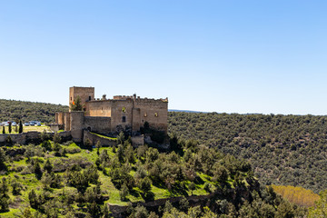 Wall Mural - Pedraza, Castilla Y Leon, Spain: view of Pedraza Castle perched on a cliff from Mirador the Tungueras. Pedraza is one of the best preserved medieval villages of Spain