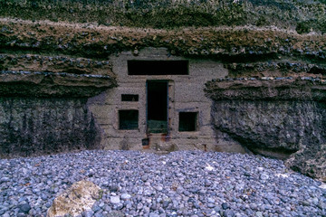 Fortified bunker of world war 2 in the chalk cliff on the beach of Etretat, Normandy, France