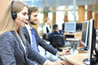 © ty - Female customer support operator with headset and smiling.