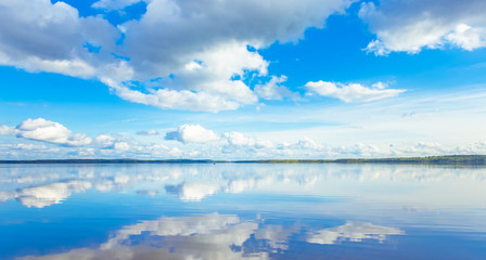 Wall Mural - Summer lake landscape with fine reflections and dramatic sky. Sotkamo, Finland.