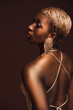 back view of african american woman with short hair isolated on brown