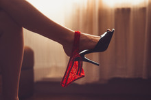 Sexy Woman Legs In High Heel Mules. Women Fetish Shoe Dangling On Feet. Shoeplay, Shoe And Foot Fetish. Beautiful Woman Flirting. Woman's Heel Slippers