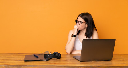 Business woman in a office having doubts