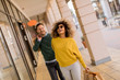 © BGStock72 - Beautiful young multiethnic couple enjoying in shopping, having fun in the city
