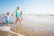 © Lsantilli - mother and her children playing on the beach