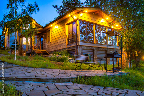 Evening Illuminated Cottage In Karelia Country House With