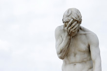 Facepalm - Ashamed, Sad, Depressed. Statue With Head In Hand
