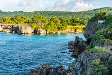 Scenic Caribbean Island Coastal Cliff Views. Coastal Countryside Setting On Sunny Summer Day In Tropical Portland, Jamaica. Turquoise Blue Ocean Water And Endless Landscape With Lush Trees And Plants.