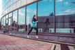 © byswat - Woman sports trainer, summer city, run jump, fitness workout. Motivation strength mind thoughts. Beautiful girl morning run. Free space. In morning, spirit, sportswear jacket leggings sneakers.