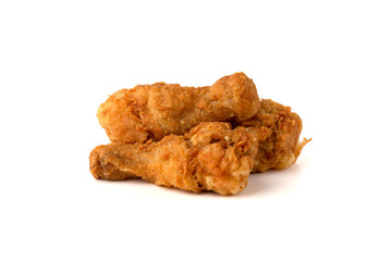 Wall Mural - Fried legs on a white background. Chicken legs deep fried close-up..