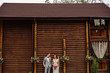 © Wedding photography - Wedding couple. Elegant bride and groom on wooden background. Portrait of beautiful newlywed couple. Rustic wedding concept