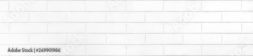 White brick wall texture or pale soft color brick wall as background.