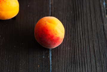 Sticker - peaches on black wood table