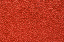 Highly Saturated Orange Orange Artificial Leather With Large Texture.