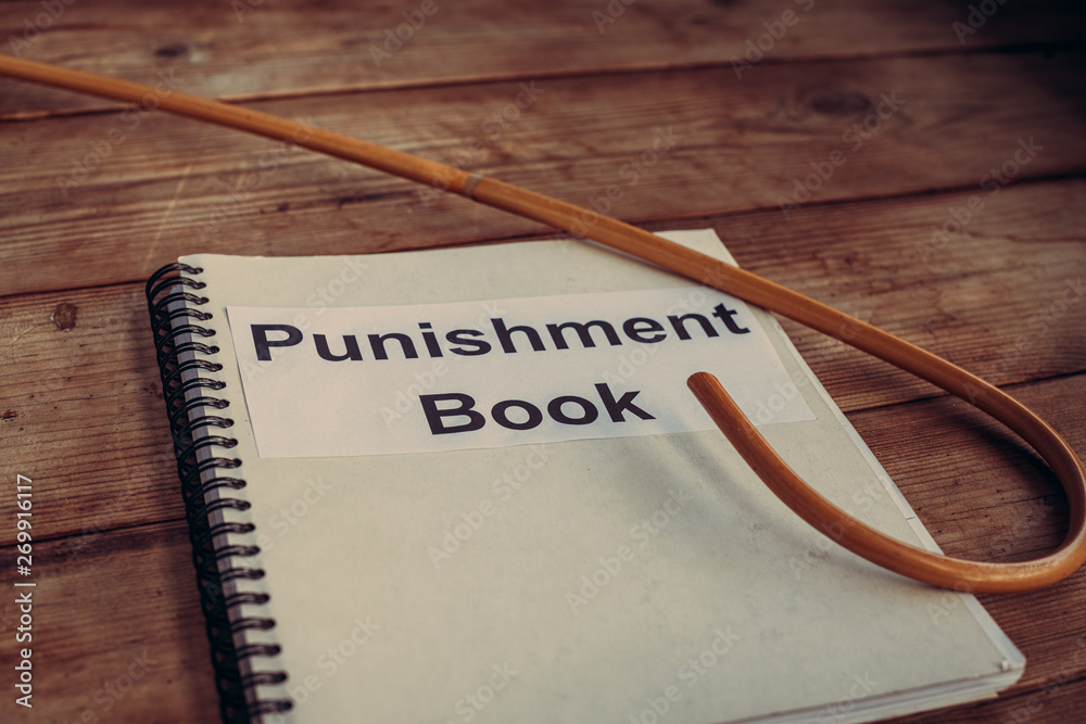 corporal punishment book. vintage school rules concept. dragon rattan