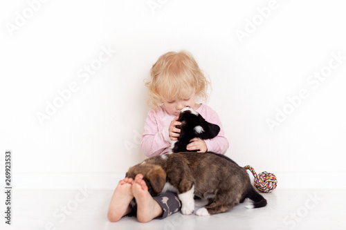 Portrait Of A Happy Curly Cute Caucasian Little Girl At Home With